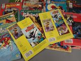 a lot of comic books that are on the table