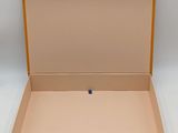 an open cardboard box on a white background with the lid open