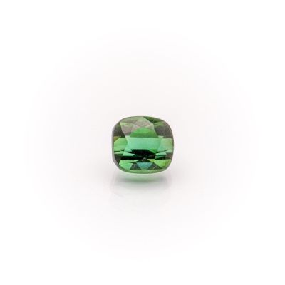 a green tourmaline stone on a white background