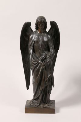 an image of a statue of an angel on a wooden base