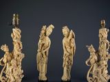 three chinese carved ivory figurines with figures on stands