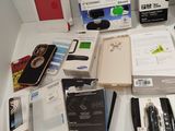 a lot of electronic items on the table in the room