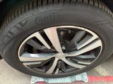 the tire of a car is shown on a piece of paper on the ground