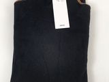 a black sweater with a tag on the back of it