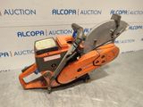 a chainsaw is sitting on a table in front of a sign