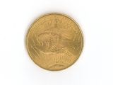 a close up of a gold coin on a white surface