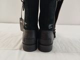 black ugg boots on a bed with a white background