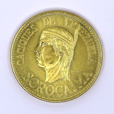 an image of a gold coin with a woman ' s face on it