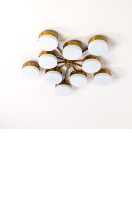un ensemble de six appliques en laiton et en verre blanc sur fond blanc