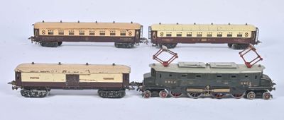 several toy trains are lined up in a row on a white surface