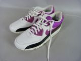 purple and white nike air max sneakers on a white surface