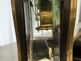 a clock that is sitting on a table in a room