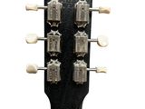 a close up of the headstock of a guitar on a white background