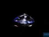 a close up of a blue diamond on a black background