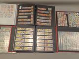 a lot of stamps and stamps in a binder