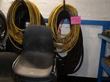 many chairs in a room with a lot of wires on the wall