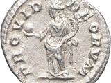 a silver coin with an image of a man holding a guitar