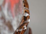 a close up view of a brown vase with water droplets on it