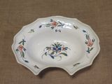 a white plate with a floral design on it