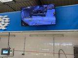 a picture of a hospital room with a tv on the wall
