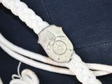 a close up of a hat with a rope around it