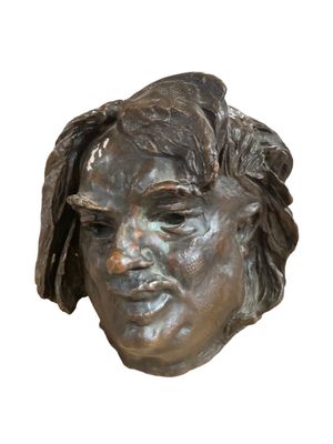 statue of a woman ' s head on a white background