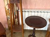 a small table and two chairs in a small room