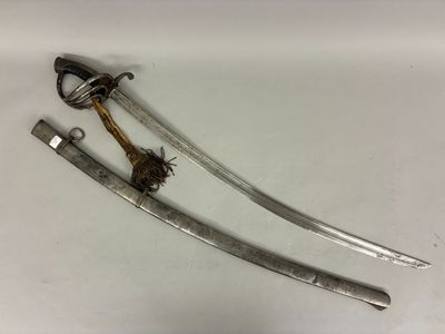 pair of swords with a wooden handle on a white surface