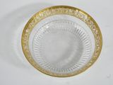 an image of a glass bowl with a gold rim on a white surface