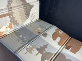 a suitcase that has a picture of animals on it