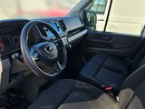 the interior of a vehicle with a steering wheel and dashboard controls