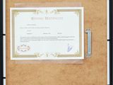 a picture of a picture of a certificate on a clipboard
