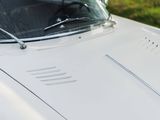 a close up of a white car with the hood up