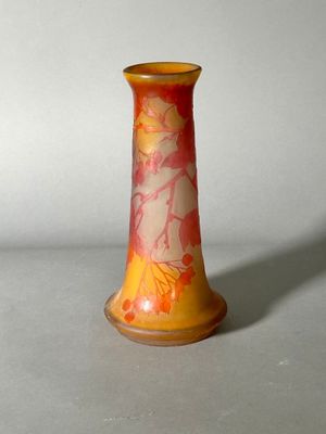 a vase with a design on it sitting on a table