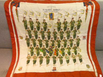 an orange and white scarf with a picture of a group of soldiers on it
