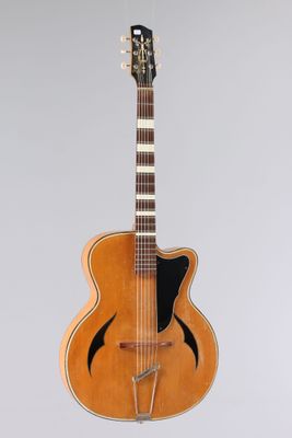 a close up of an acoustic guitar on a white background