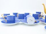 a lot of cups and saucers that are on the table