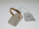 an image of a gold ring with a tag attached to it