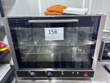 an image of an oven with a price tag on it