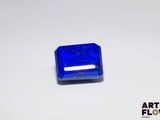 an image of a blue square shaped stone sitting on top of a white surface