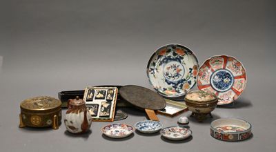 many different types of asian plates and bowls on the table