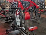 a gym with a lot of machines in the room