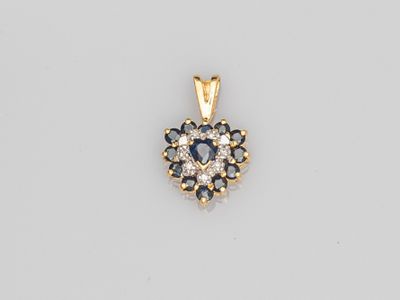a sapphire and diamond cluster pendant