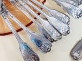 a lot of spoons that are sitting on a table