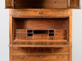 an old wooden cabinet with drawers and drawers on top of it