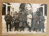 a group of men and women in uniforms posing for a picture