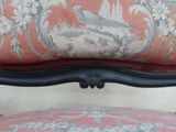 an image of a close up of a chair with a bird on it