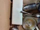 a box full of silverware and spoons in it