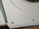 a washing machine that is sitting on a wooden pallet