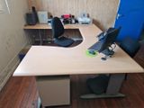 a desk with a computer monitor and a keyboard on it